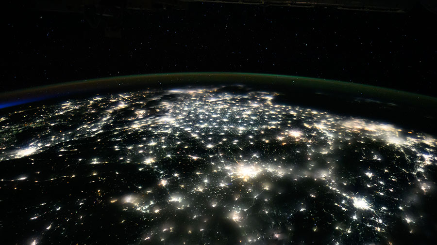 City lights illuminate the country of China to the East China Sea in this nighttime photograph from the International Space Station.