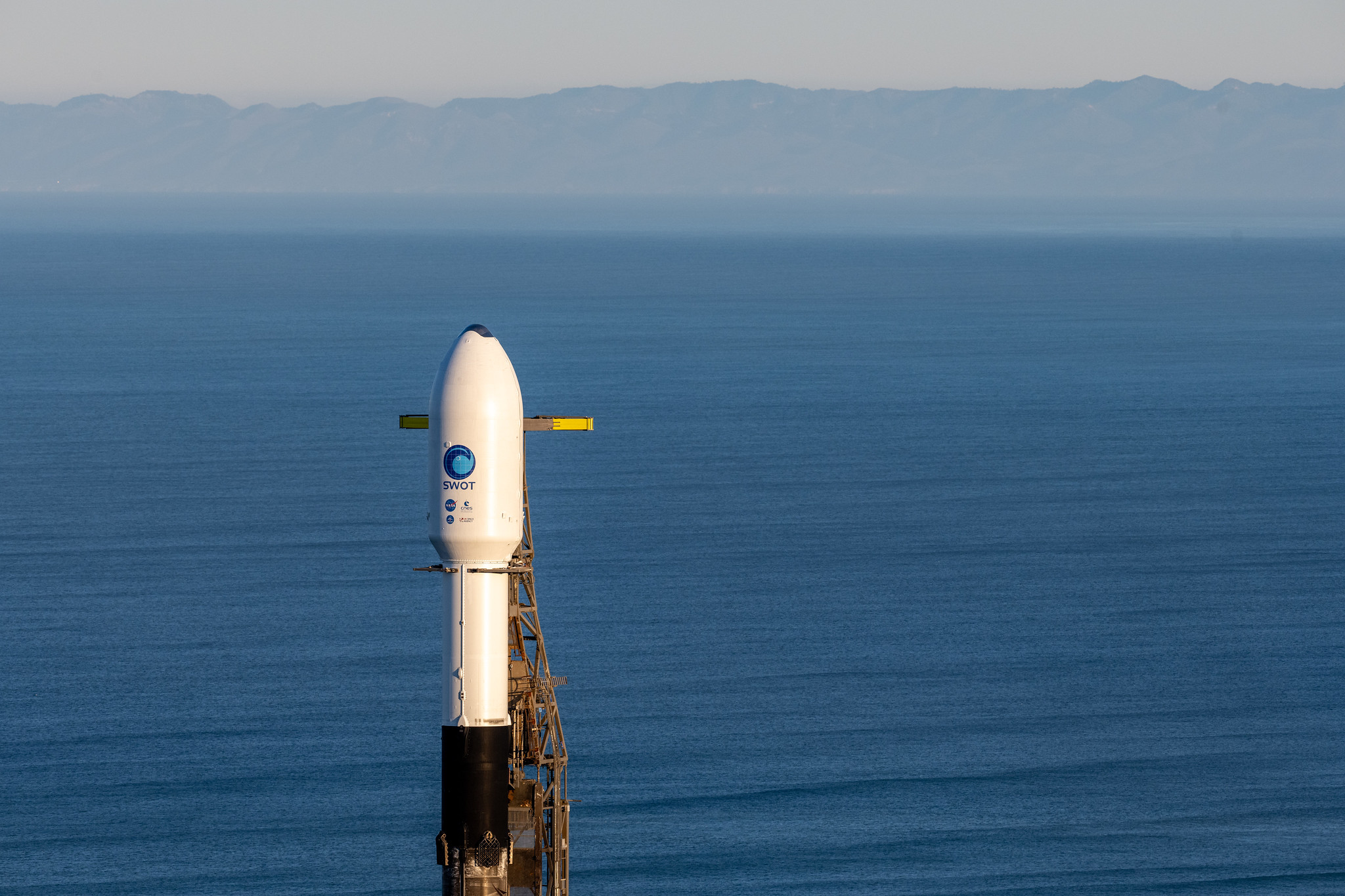 A SpaceX Falcon 9 rocket with the Surface Water and Ocean Topography (SWOT) spacecraft onboard is seen as preparations for launch continue, Wednesday, Dec. 14, 2022, at Space Launch Complex 4E at Vandenberg Space Force Base in California