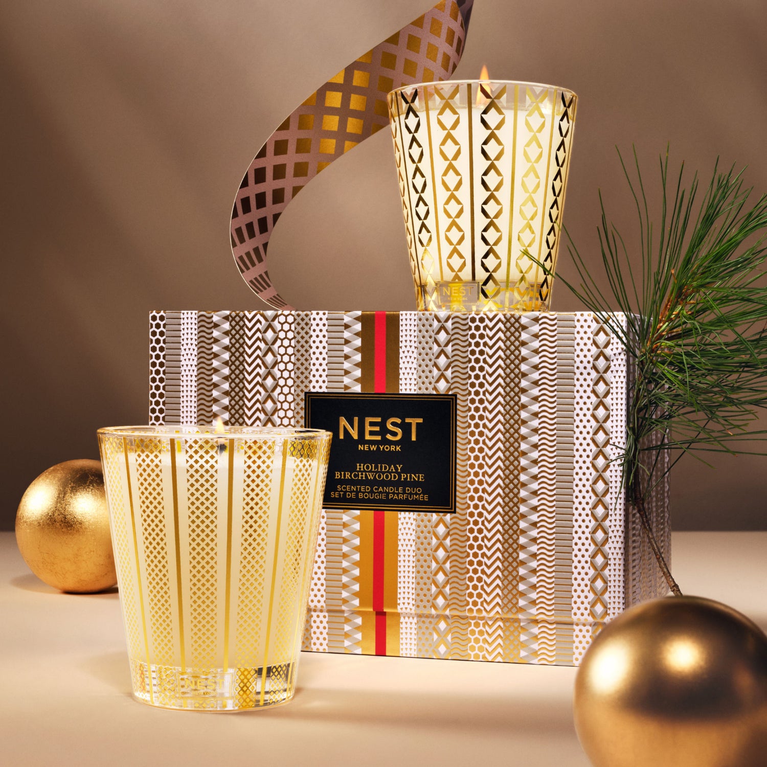 Lifestyle image of Nest Holiday and Birchwood Pine Classic Candle Set (Limited Edition)