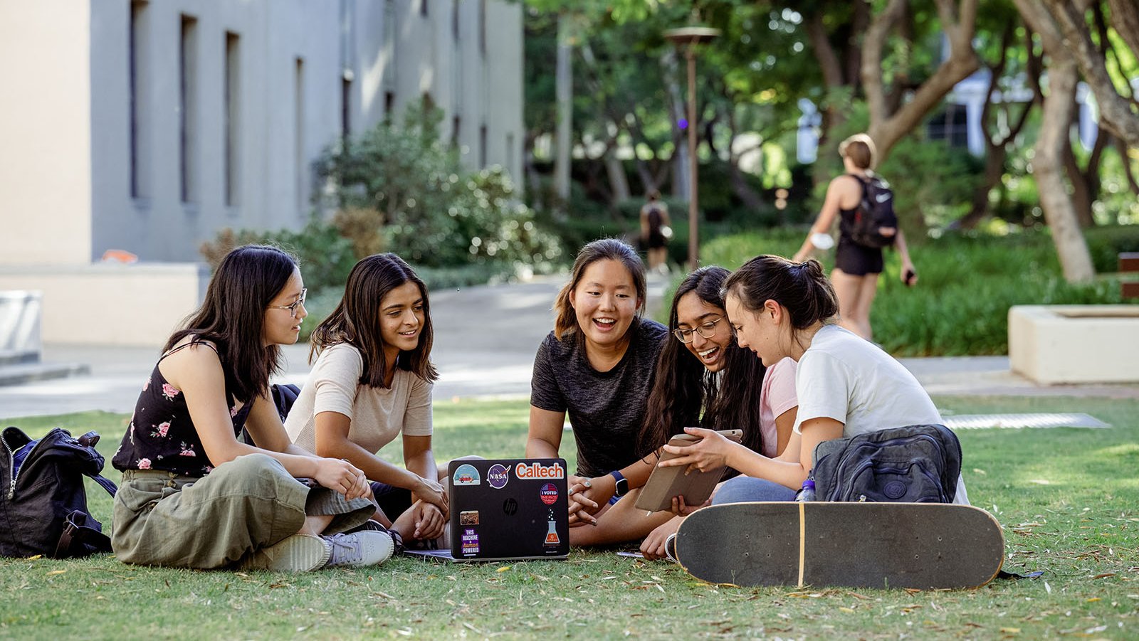 A photo of a group of students on a campus lawn