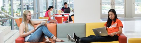 Students on a couch studying