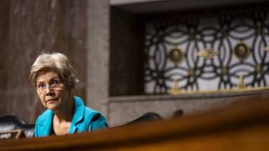 Sen Elizabeth Warren sits during a Senate committee hearing.