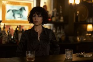 dark haired woman tending bar