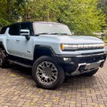 A hummer EV SUV seen parked on a drive