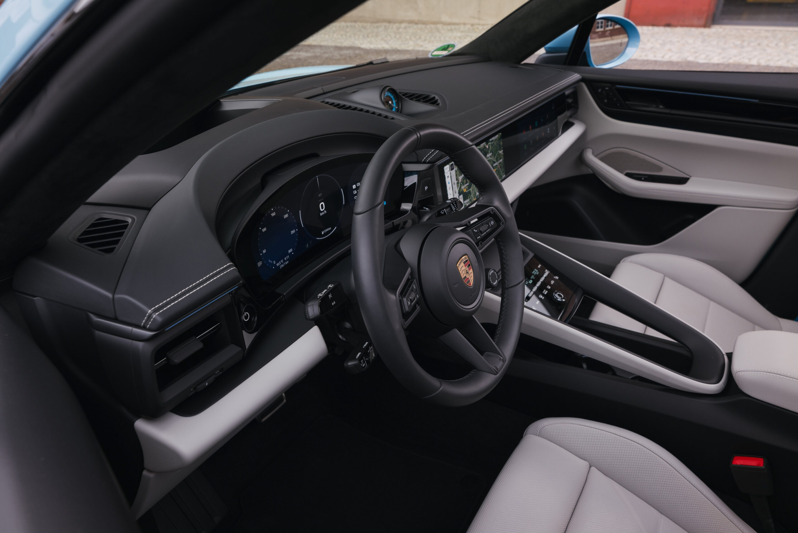 A white and black Porsche Macan EV interior