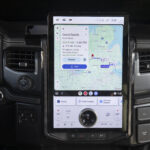 A Ford F-150 Lighting dashboard showing the infotainment system, which is displaying Google Maps being cast from Android