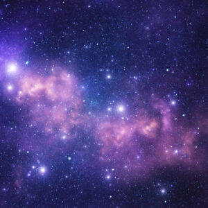 Image of a purple nebula speckled with stars against a dark backdrop.