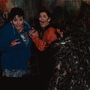 two women terrified in a haunted house