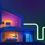 Purple/blue rendering of a home with a number of different colored lights inside, with a circuit-like line leading into it.