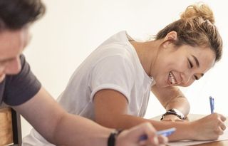 Young Asian couple studying at home