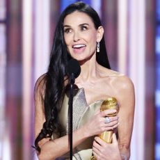 Demi Moore accepts her Golden Globe Award for 'The Substance,' at the 2025 Golden Globes.