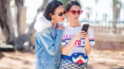 Two women looking at phone