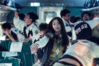 a young girl runs through chaos on a train in Train to Busan