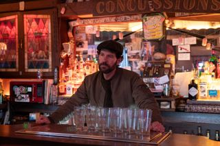 Paul Rudd as Glen Stubbins, standing behind a bar, in 'Only Murders in the Building' season 4