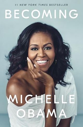 Becoming by michelle obama book cover with a photo of her portrait smiling and holding her hand to her face