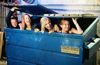 a group of teenage girls peek out from a dumpster in the movie Sleepover