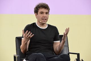 jon lovett doing a live talk for lovett or leave it podcast