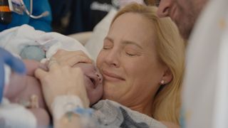 a woman holds a newborn in a still from zurawski vs texas