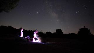 a couple look at meteor streaks across the sky against a field of stars during a meteorite shower in ronda late on august 11, 2020 photo by jorge guerrero afp photo by jorge guerreroafp via getty images