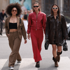 Group of women walking on the street during fashion week.