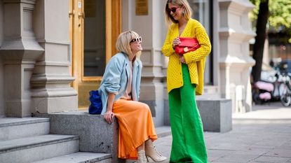 Emili Sindlev wearing yello knit cardigan and green wide leg pants