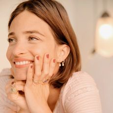 Marina Duenas Jacobs poses wearing a stack of her favorite rings