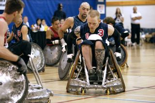 a team of rugby players in wheelchairs on the court in the documentary murderball