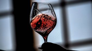 a person tastes wine, on may 29, 2020 during the 105th tasting of the chevaliers du tastevin brotherhood in chateau du clos de vougeot, in vougeot photo by jeff pachoud afp photo by jeff pachoudafp via getty images