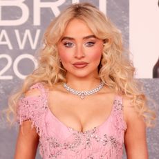 Sabrina Carpenter wears a pink McQueen gown to the BRIT Awards 2025