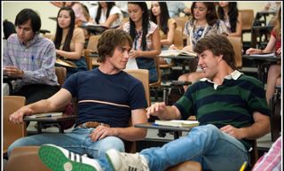 two boys dressed in 80s apparel sit in a college lecture in everybody wants some