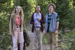 everything sucks netflix series starring sydney sweeney still featuring three teenagers in the woods in 90s like clothes