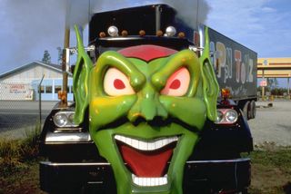 a massive semi truck with a monster face in the movie maximum overdrive