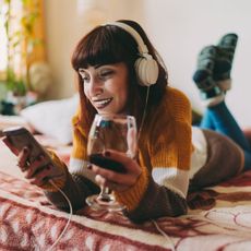 Woman on Video Call Drinking Wine