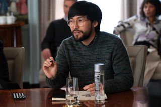 Jin Ha as screenwriter marshall wearing glasses and a beard in 'Only Murders in the Building' season 4