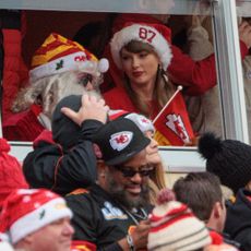 Taylor Swift wearing a Santa hat at the Kansas City Chief's Christmas day game in 2023.