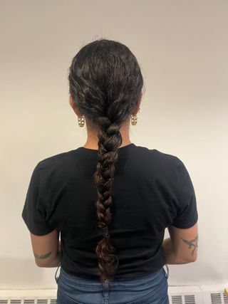 photo of Gabrielle Ulubay from the back wearing a braid in her hair