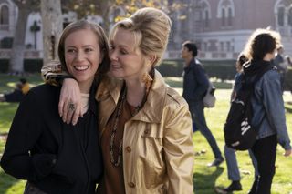 hannah einbinder as ava and jean smart as deborah walking through a campus quad in Hacks