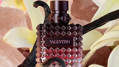 valentino bella dona intense perfume on a floral background