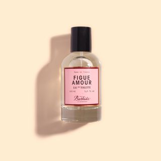 Figue Amour Eau De Toilette on beige background