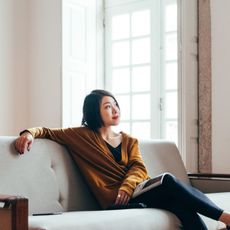 Woman sitting on sofa