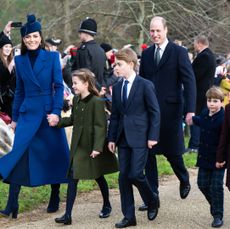 Kate Middleton, Princess Charlotte, Prince George, Prince William and Prince Louis wearing coats and walking to church for Christmas service