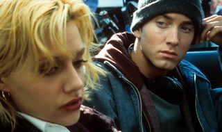 Brittany Murphy and Eminem look pensive while sitting in a cast in '8 Mile'