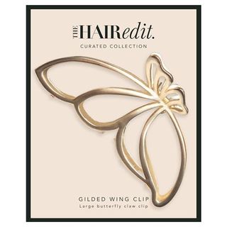 The Hair Edit Gilded Wing Clip in its cardboard packaging on a white background