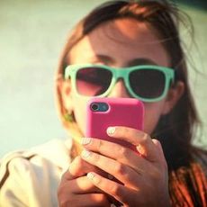 woman staring at phone