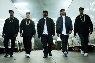 The stars of 'Straight Outta Compton' as nwa waling by two tour buses