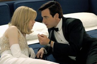 renee zellweger and ewan mcgregor stare into each other's eyes while wearing evening wear in down with love