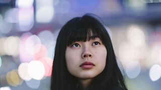 Portrait of young woman at night