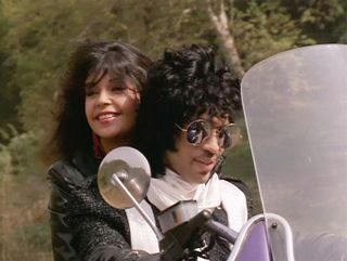 Apollonia and Prince riding on a motorbike in 'Purple Rain'