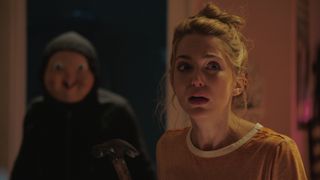 jessica rothe being followed by a masked figure in Happy Death Day