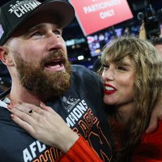 Travis Kelce and Taylor Swift celebrate the Kansas City Chiefs' win in the AFC Championship Game at M&T Bank Stadium on January 28, 2024.